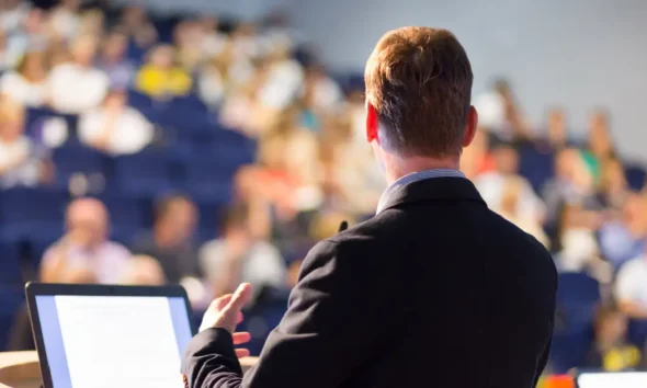 Group Of Speakers At Conference NYT